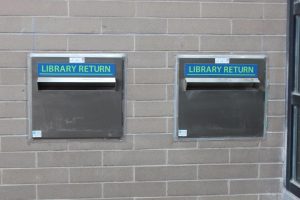 Close-up of exterior book return slots.