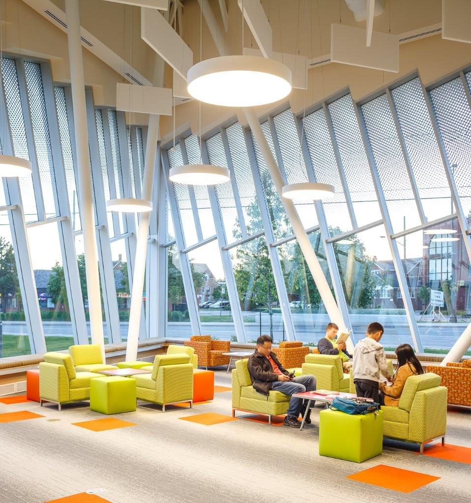High ceilings with rectangular baffles and circular lighting give "shape" to a comfortable area to read.