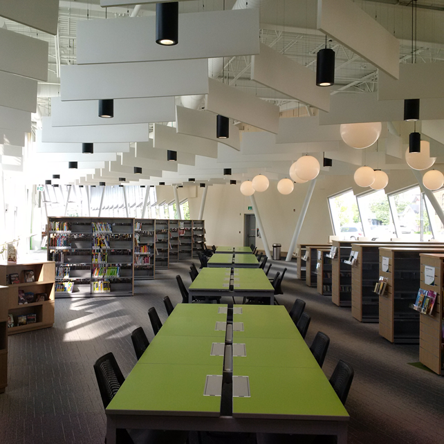 Long green table inside of library