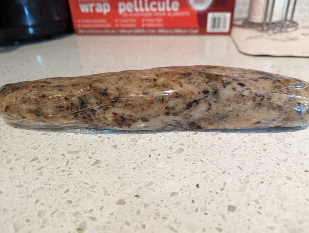Cookie dough rolled in plastic wrap.