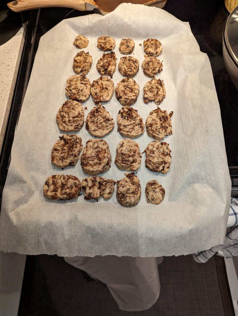 Baked Cookies laid out on a cookie sheet.
