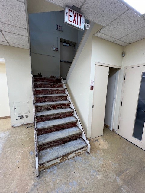 Interior image of the Woodbridge Library. Railings have been removed from the interior staircases making way for new ones to be installed.