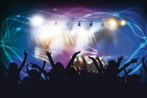 silhouettes of people enjoying a concert